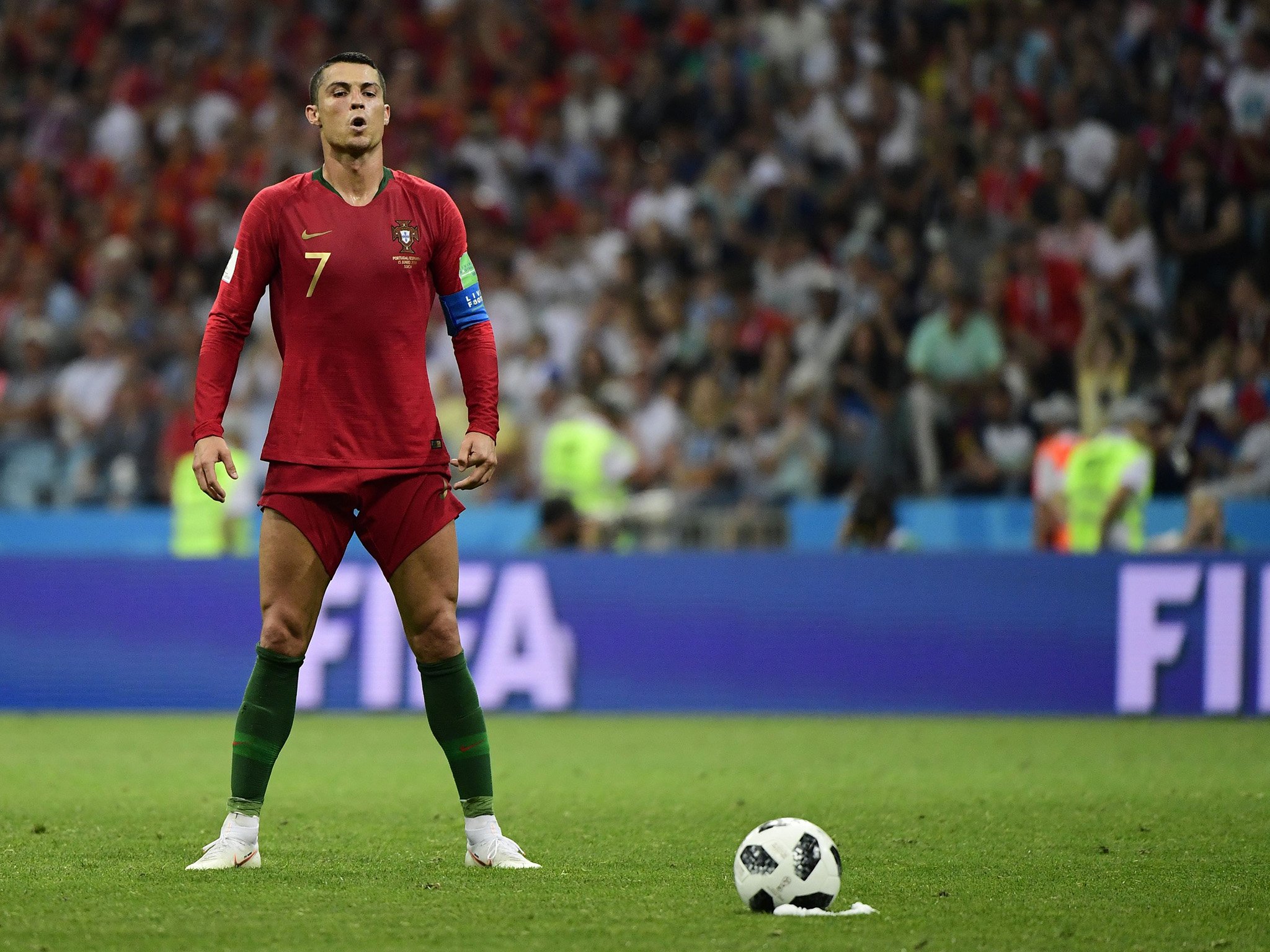 14006762-soccer-player-standing-with-a-ball-player-in-full-image.jpg